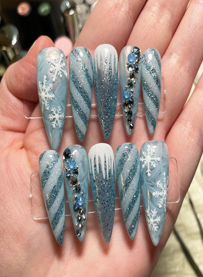 LRKNNO Christmas Press on Nails Medium Almond Fake Nails Blue Snowflake False Nails with 3D Rhinestones Designs Glitter Winter Glue on Nails Full Cover Acrylic Artificial Nail for Women DIY Manicure 24 Pcs - Image 1